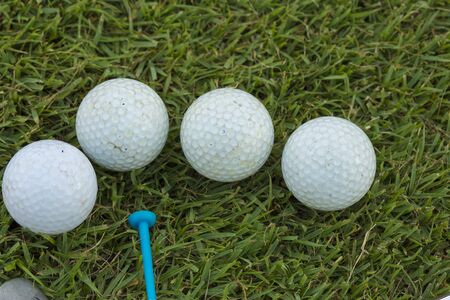 Golf Ball and Golf Club on grassの写真素材