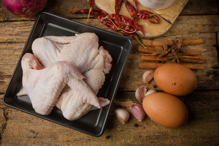 aw chicken wings with spices - ready for cookingの写真素材