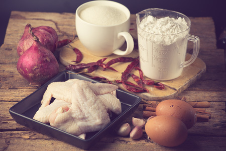 aw chicken wings with spices - ready for cooking vintage colorの写真素材