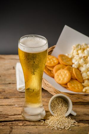 Glass of light beer on black backgroundの写真素材