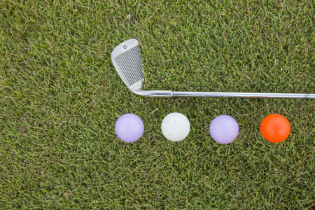 Golf Ball and Golf Club on grassの写真素材