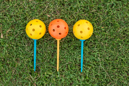Golf club and ball in grassの写真素材