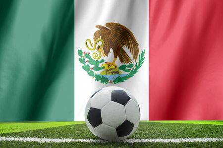 Ball streaks across the flag of Mexico, where soccer is a national passion.の写真素材