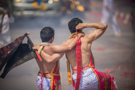 Nakhon Ratchasima, THAILAND - OCT 16: An unidentified devotee of Vegetarian Festival, person who invites the spirits of gods to possess their bodies on October 16, 2015 in Nakhon Ratchasima, Thailandの写真素材