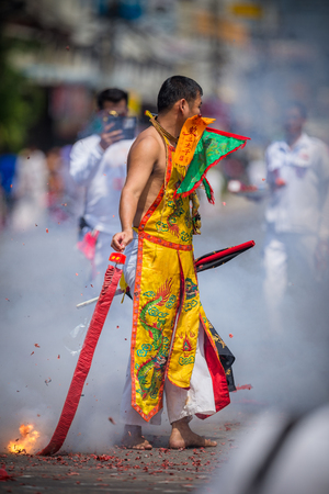 Nakhon Ratchasima, THAILAND - OCT 16: An unidentified devotee of Vegetarian Festival, person who invites the spirits of gods to possess their bodies on October 16, 2015 in Nakhon Ratchasima, Thailandのeditorial素材