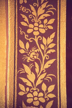 traditional Thai style art gold painting pattern on the door vintage colorの写真素材