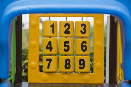 Cubes with numbers are on playground.の写真素材