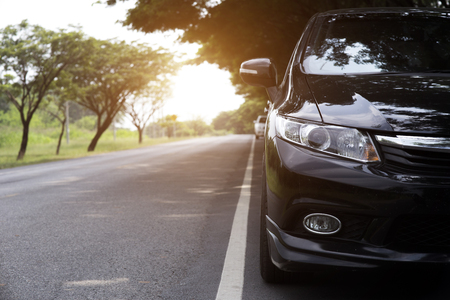 Car on asphalt road in summerの写真素材