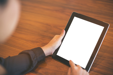 female teen hands using tablet pc with white screen, isolatedの写真素材