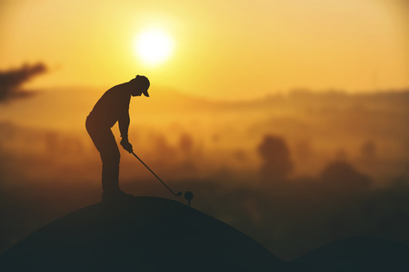 silhouette of golfers hit sweeping and keep golf course in the summer for relax time.Vintage colorの写真素材
