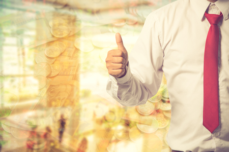 Businessman showing OK sign with his thumb up.Vintage colorの写真素材