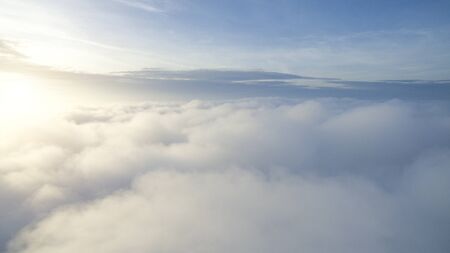 Sunny sky abstract background, beautiful cloudscape, on the heaven, view over white fluffy clouds, freedom concept.soft focusの写真素材