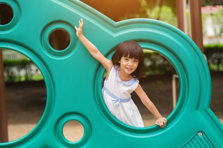 Active little girl on playgroundの写真素材