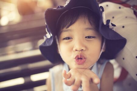 little girl sends kissの写真素材
