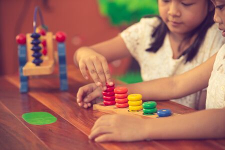 child little girl playing wooden toysの写真素材