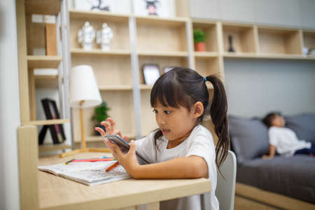 Asian girl student online learning class study online video call zoom teacher, Happy girl learn...