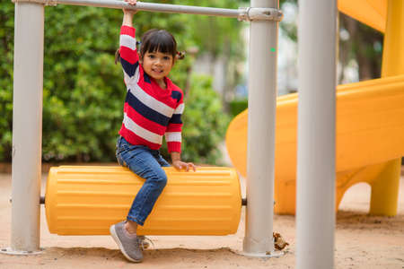 Active little girl on playground