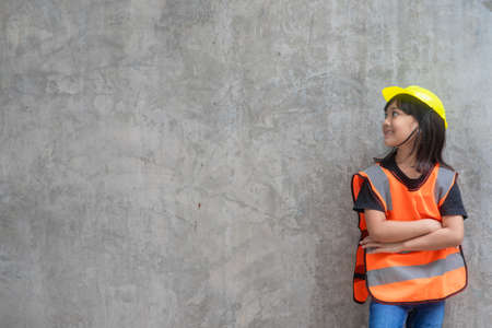 Asian Kid girl wearing reflective shirts and a hat yellow. To learning and enhance development,...