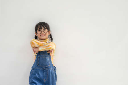 Portrait of funny smiling little girl child wearing glassesの写真素材