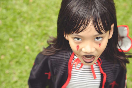 Happy Halloween! The cute little girl in Halloween costumeの写真素材