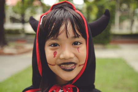 Happy Halloween! The cute little girl in Halloween costumeの写真素材