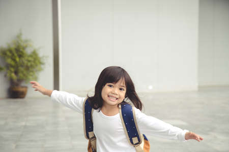 Pupils of school. Girls with backpacks. Beginning of lessons. First dayの写真素材