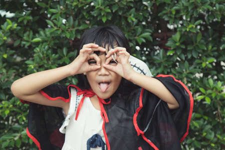 Children in costumes going to trick or treatの写真素材