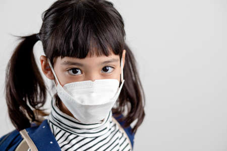 Child with face mask going back to school