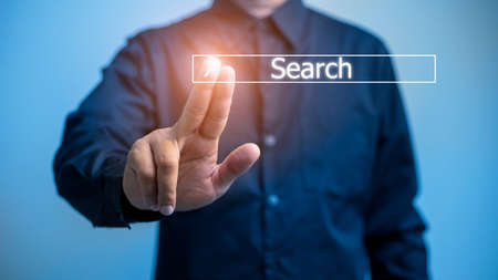 Data Search Technology Search Engine Optimization. man's hands are using a computer notebook to...
