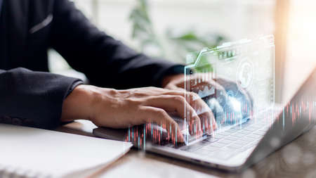 business finance technology and investment concept. Stock Market Investments Funds and Digital Assets. businessman analyzing forex trading graph financial data. Business finance background.の写真素材