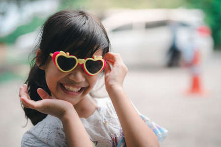 Beautiful girl wearing glasses with a big surprise on her face posing