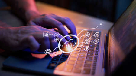man use Laptop with cloud computing diagram show on hand. Cloud technology. Data storage. Networking...