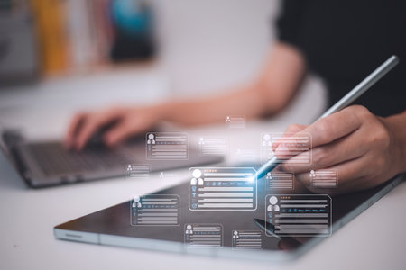 HR(human resources) technology.Online and modern technologies for simplifying the human resources system.Human resource manager checks the CV online to choose the perfect employee for his business.の写真素材