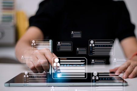 HR(human resources) technology.Online and modern technologies for simplifying the human resources system.Human resource manager checks the CV online to choose the perfect employee for his business.の写真素材