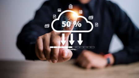 Cloud storage technology concept. Businessmen use laptops to synchronize documents or data to online storage. Upload and download files. Data sharing and transfer network.の写真素材