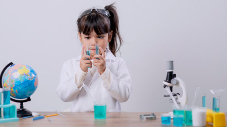 Asian Student Mixing Solution in Science Experiment Laboratory Classの写真素材