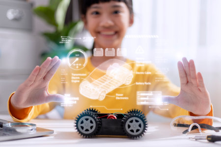 Asian little girl learning electric car system.Eco friendly alternative energy conceptの写真素材