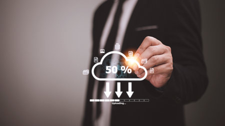 Cloud storage technology concept. Businessmen use laptops to synchronize documents or data to online storage. Upload and download files. Data sharing and transfer network.の写真素材