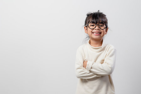 Asian little girl thinking something select focus shallow depth of field with copy spaceの写真素材