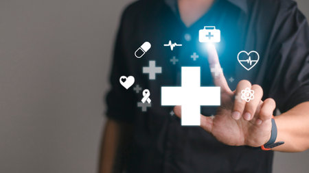 Businessman hold virtual plus medical network connection icons. Covid-19 pandemic develop people awareness and spread attention on their healthcare.Doctor,document,medicine,ambulance,patientの写真素材