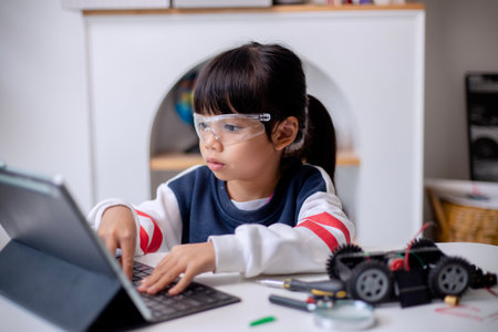 Asia students learn at home in coding robot cars and electronic board cables in STEM, STEAM,...