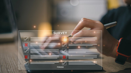 businesswoman Take an assessment, questionnaire, evaluation, online survey online exam Choosing the right answer in the exam, filling out an online survey form. Answer the test questions.の写真素材
