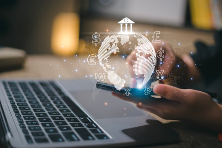 Women use mobile phones and laptop computers for money transfers and currency exchanges between countries of the world. online banking interbank payment concept.の写真素材