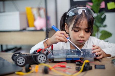 Asia students learn at home in coding robot cars and electronic board cables in STEM, STEAM,の写真素材