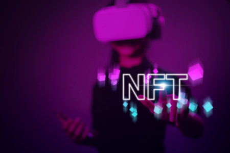 Women with virtual reality VR goggle finger touch virtual screen, NFT token digital crypto art blockchain technology conceptの写真素材