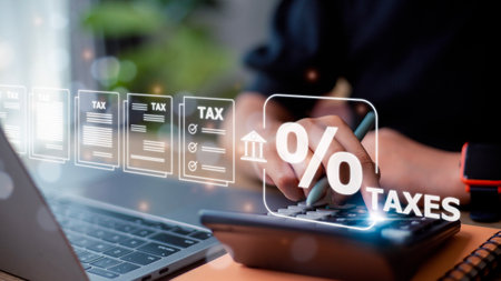 Corporate and individual tax payment concept, woman using computer filling out corporate and personal income tax return, VAT and property tax of business.の写真素材