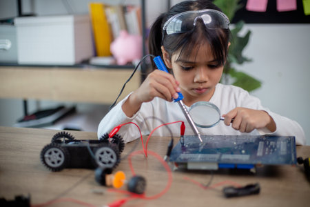 Asia students learn at home in coding robot cars and electronic board cables in STEM, STEAM,の写真素材