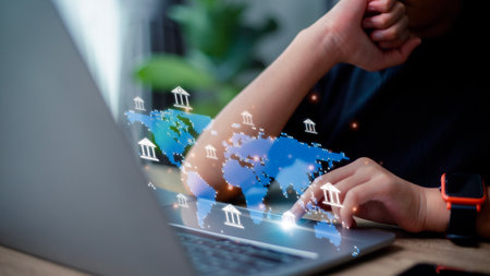 Online banking interbank payment concept. Women use laptop computers for money transfers and currency exchanges between countries of the world.の写真素材