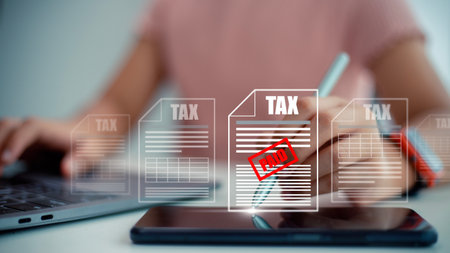 Corporate and individual tax payment concept, woman using computer filling out corporate and personal income tax return, VAT and property tax of business.の写真素材