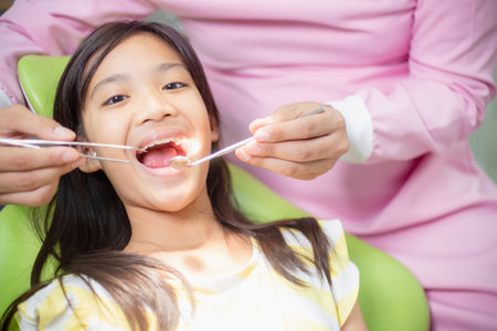 Little Asian girls teeth are healthy in the Dental office. Dental care, Dentist care.